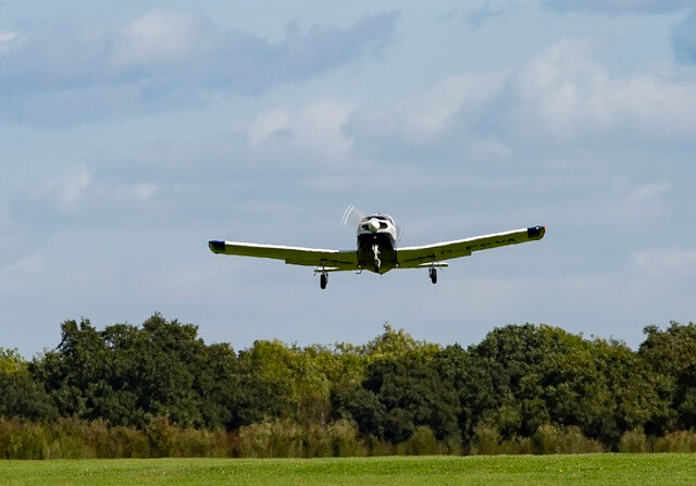 A student pilot in the cockpit learning to fly an airplane, representing the journey of obtaining a Private Pilot License.